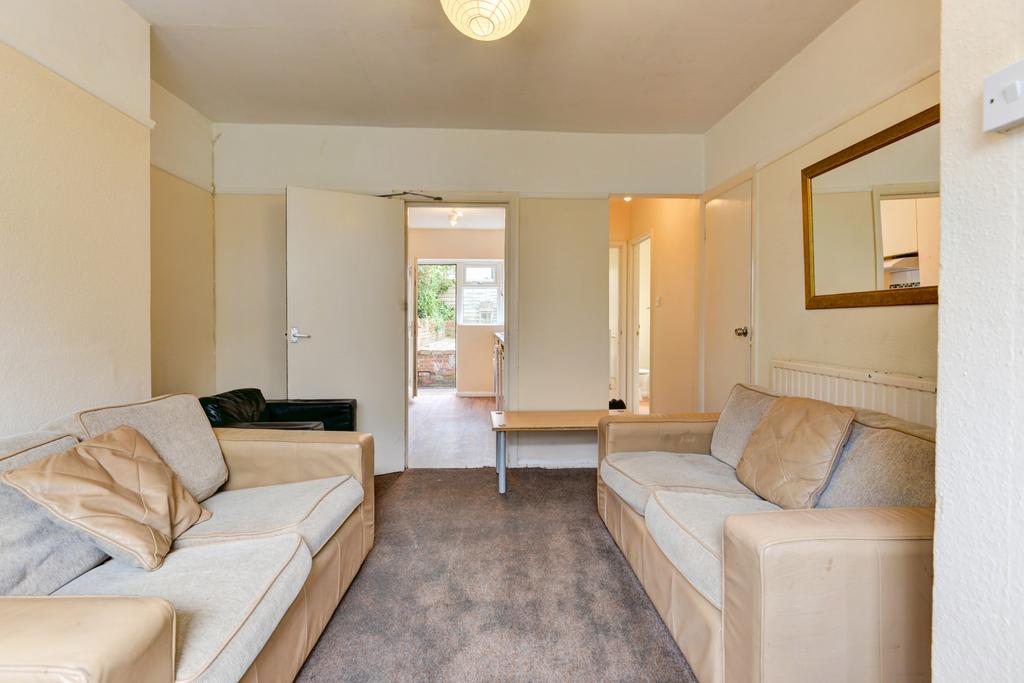 A bright and inviting living room with comforta...
