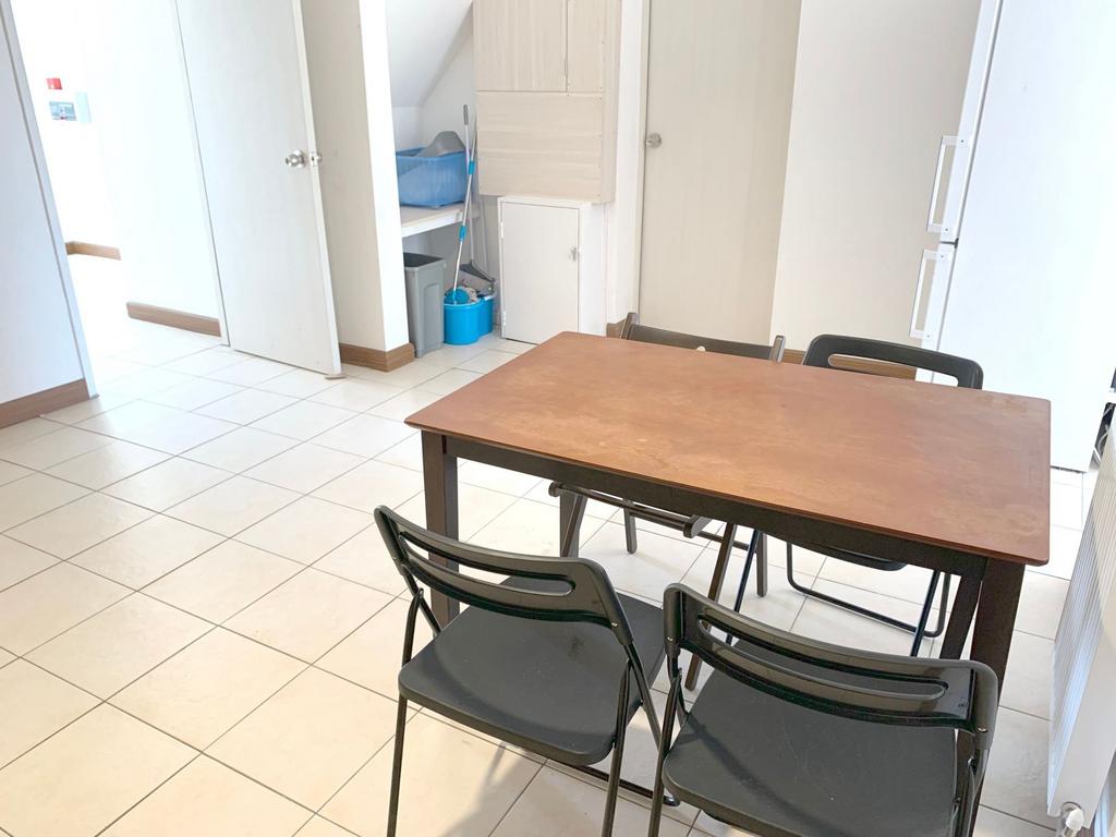 Bright, clean communal lounge area featuring a ...