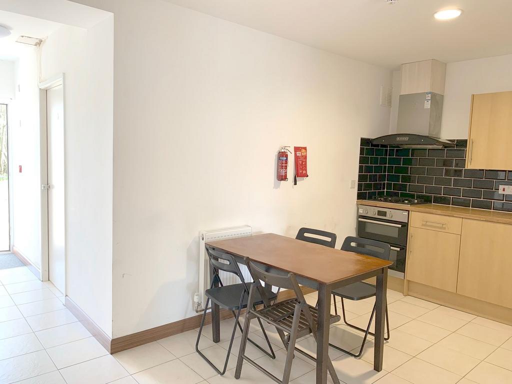 Bright and functional kitchen featuring a woode...