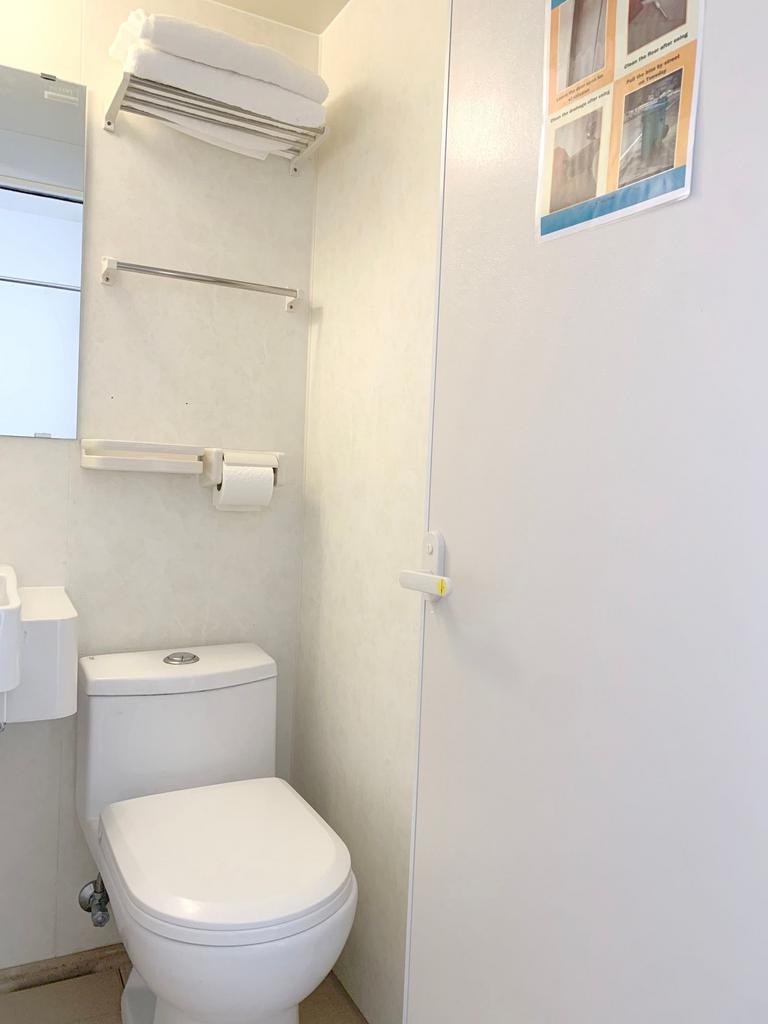 A clean and well-maintained compact toilet area...