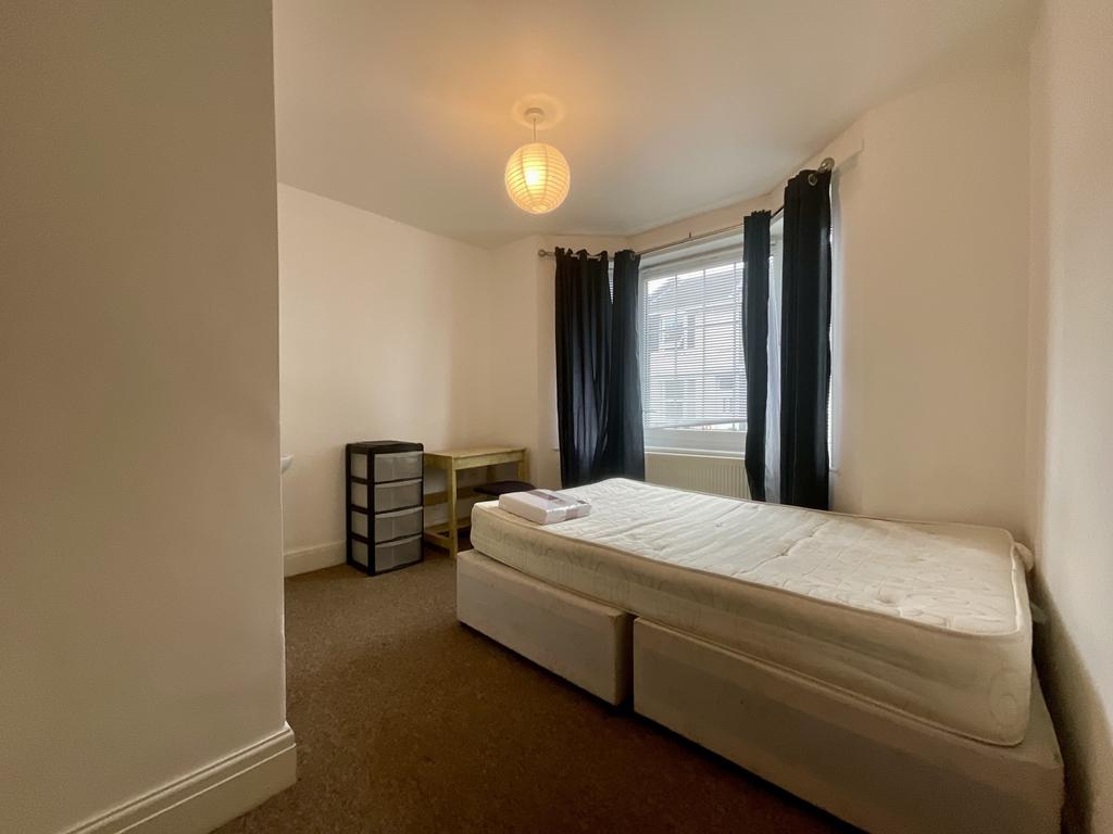 Bright and spacious master bedroom featuring a ...