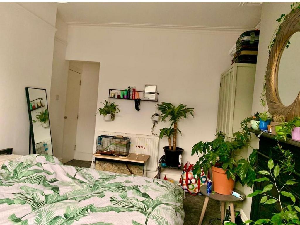 A bright and inviting bedroom filled with natur...