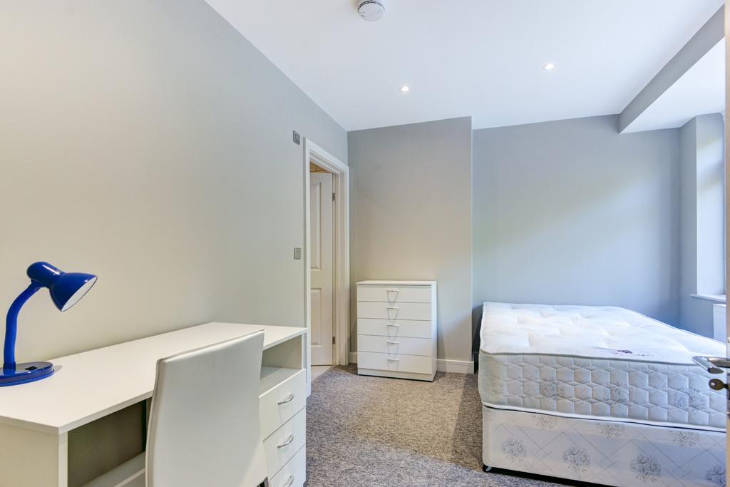 A bright and clean bedroom featuring a mattress...