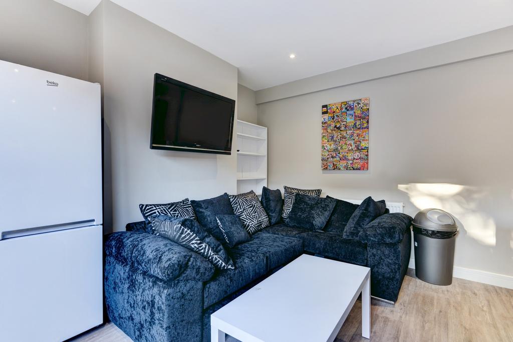 A modern living room featuring a large, comfort...