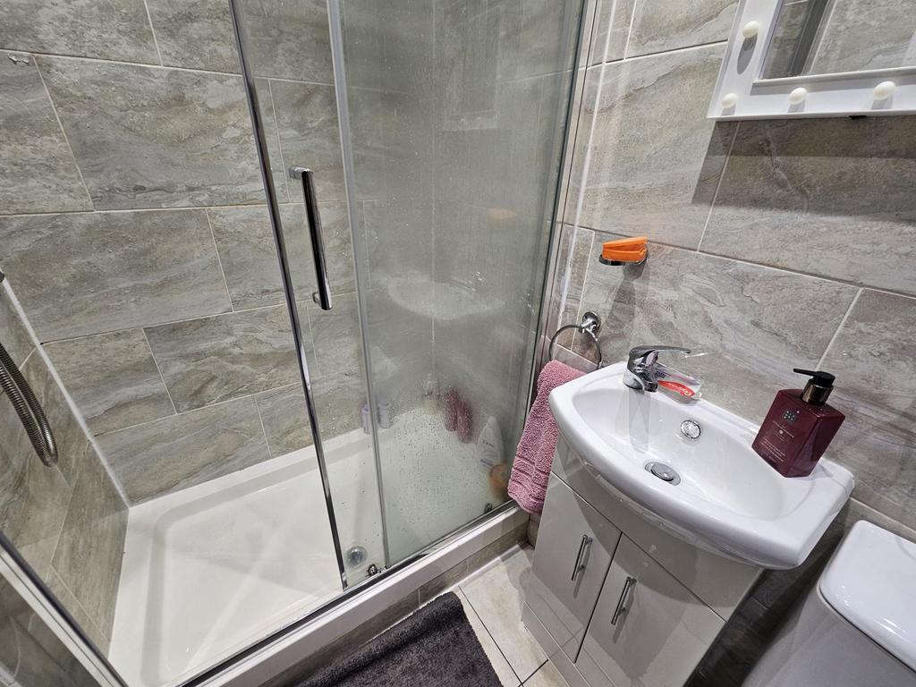 A clean and modern bathroom featuring a spaciou...