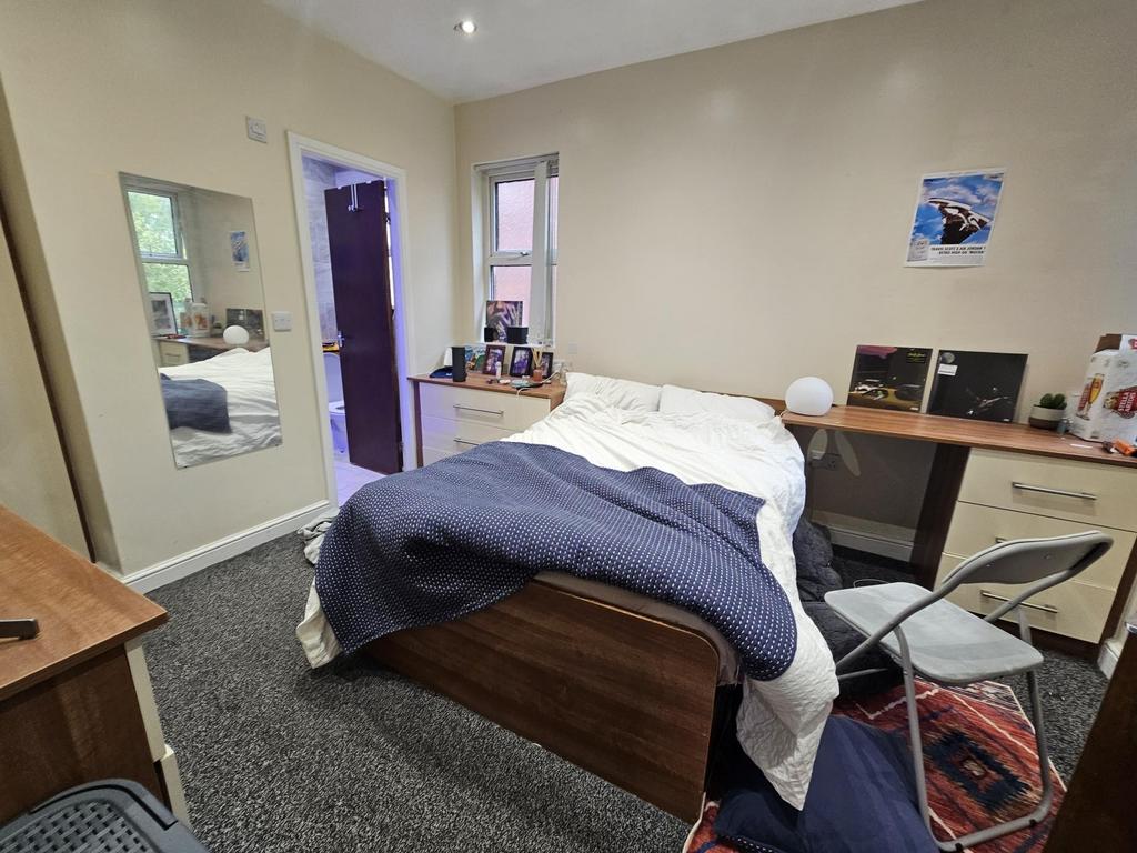 A spacious and well-maintained master bedroom f...
