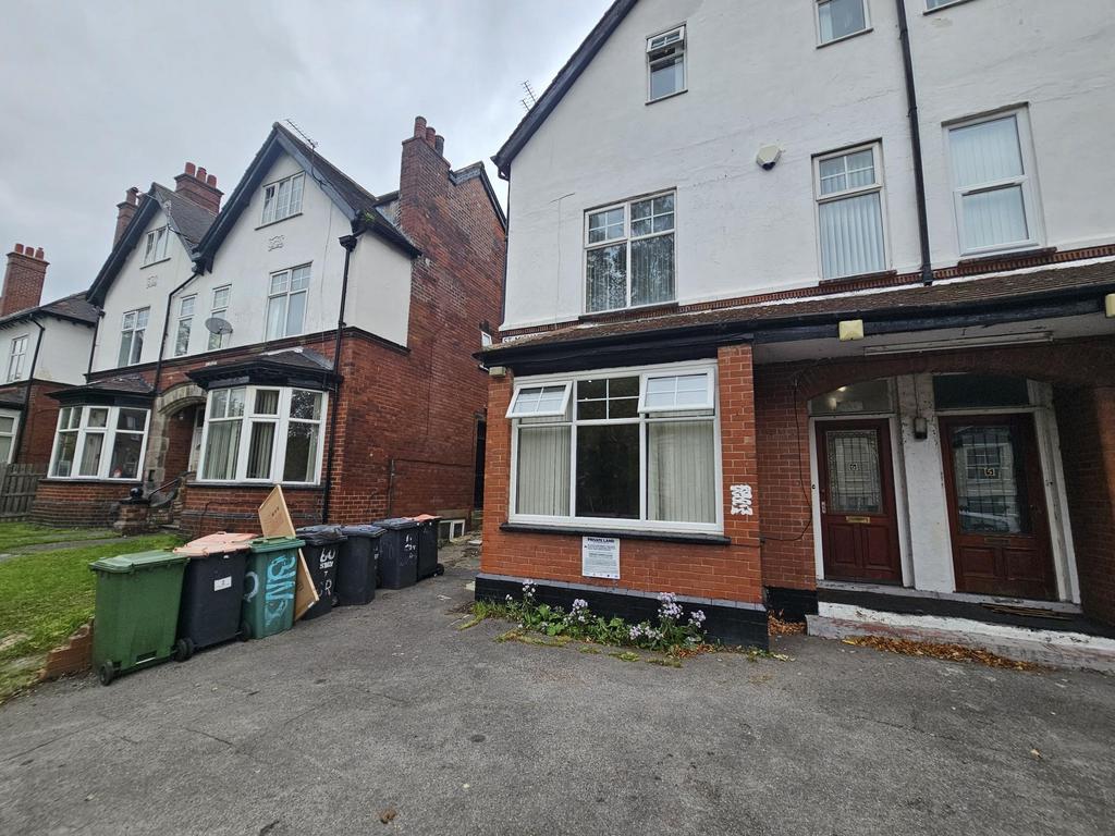 The front exterior of a traditional terraced ho...