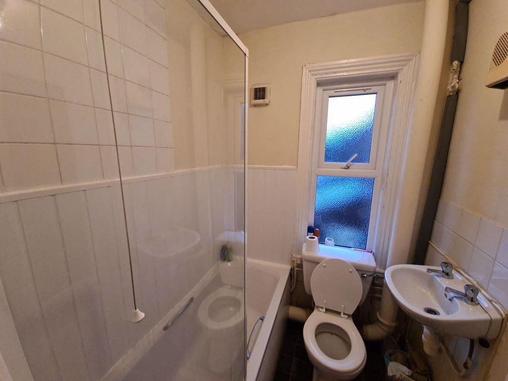 A clean and functional bathroom suite featuring...