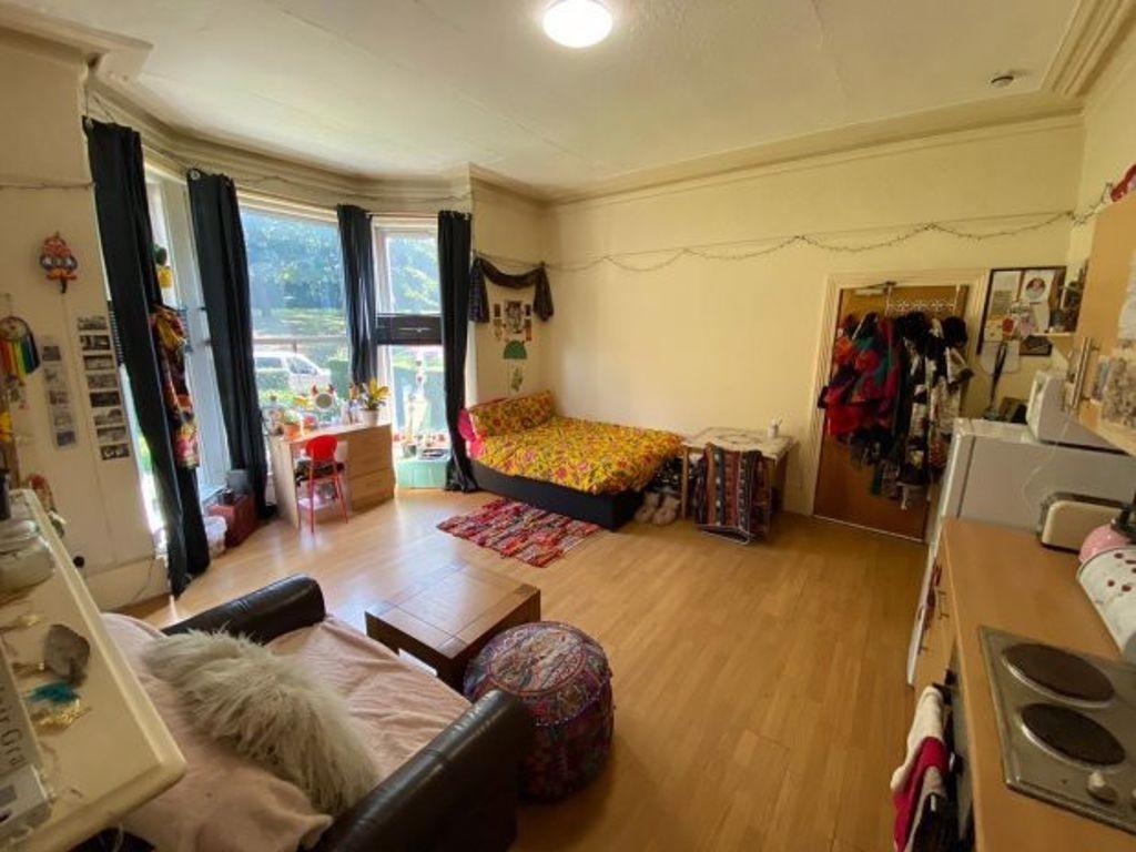 Spacious master bedroom featuring a cozy double...