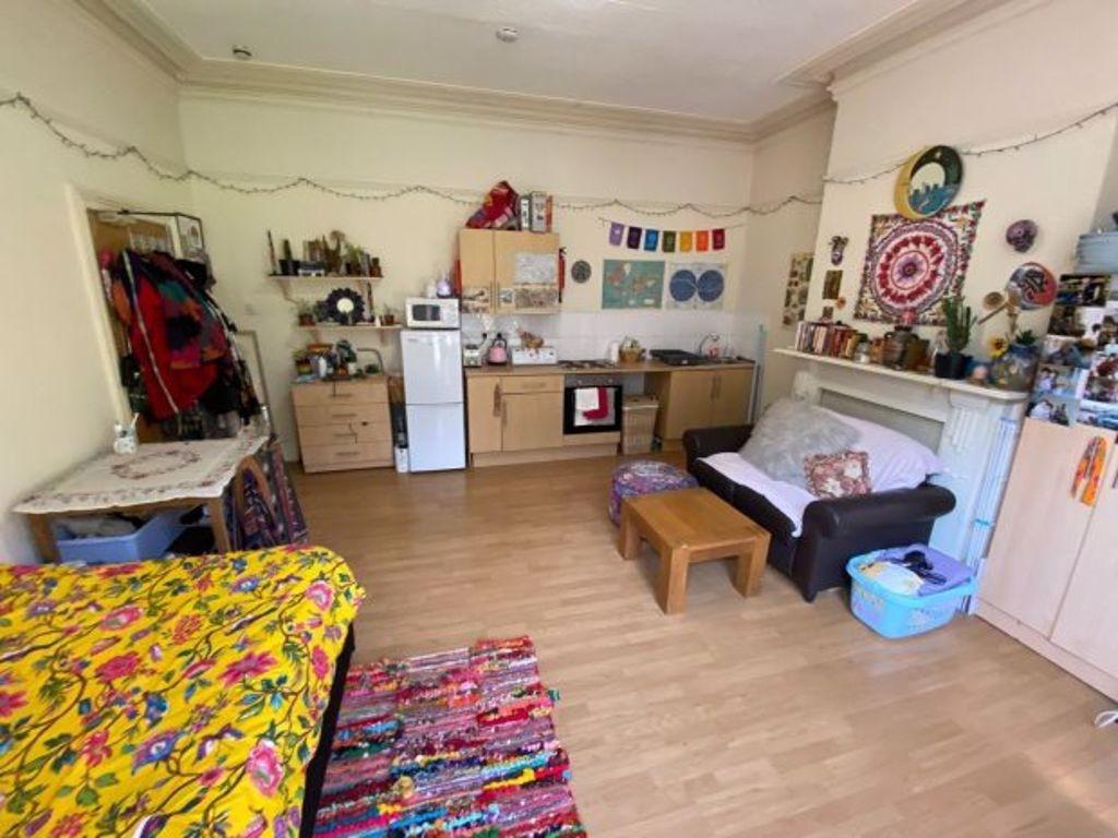 A cozy living room with a colorful and eclectic...