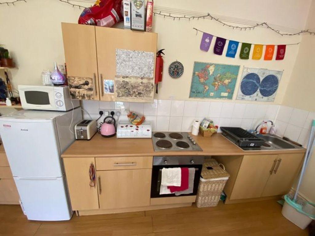 A compact and practical kitchen space featuring...