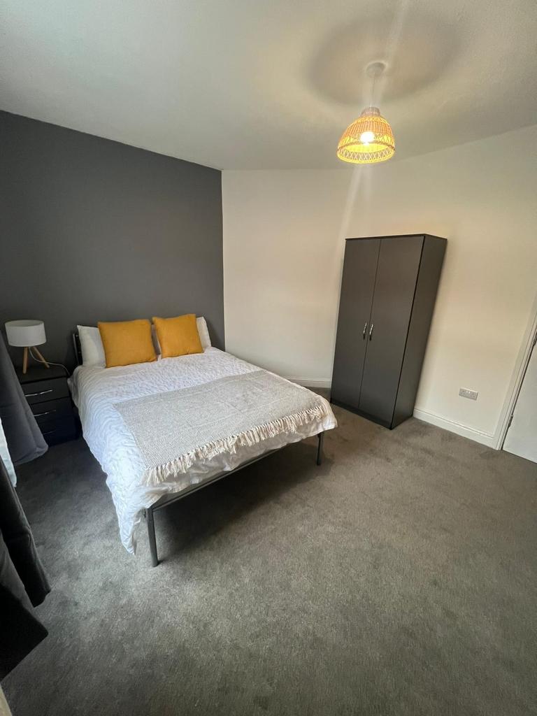 A modern double bedroom featuring a comfortable...