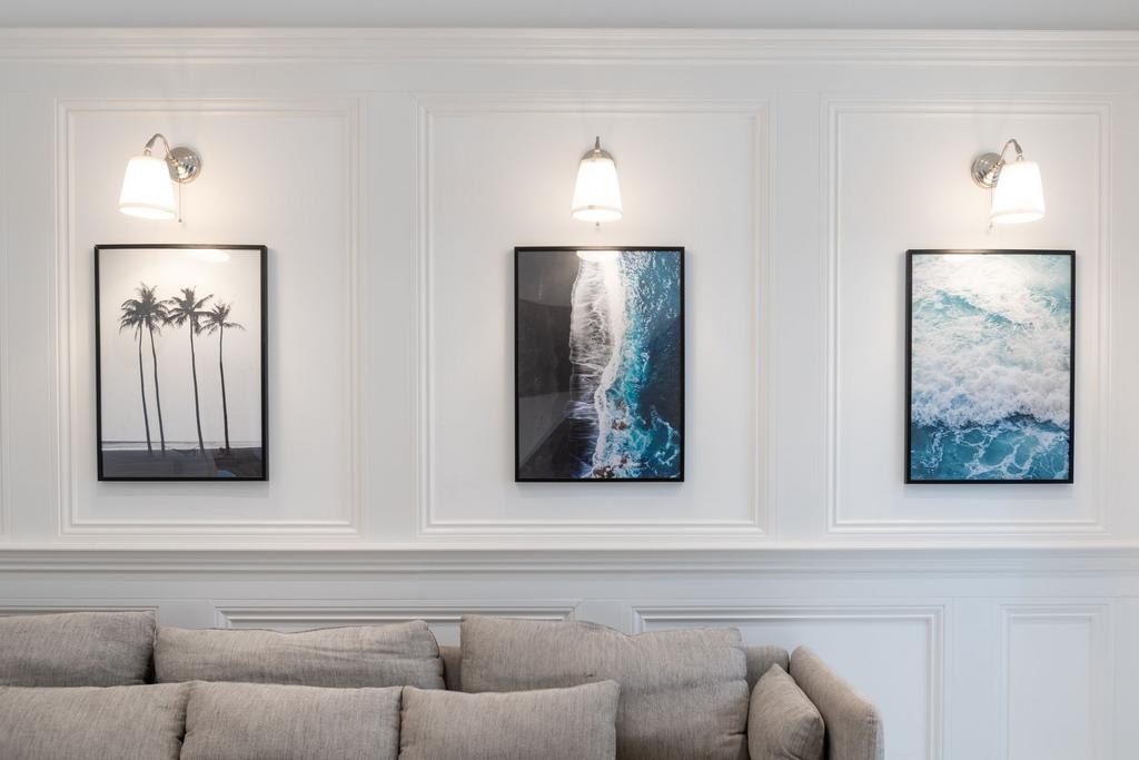 Bright contemporary living room wall with three...