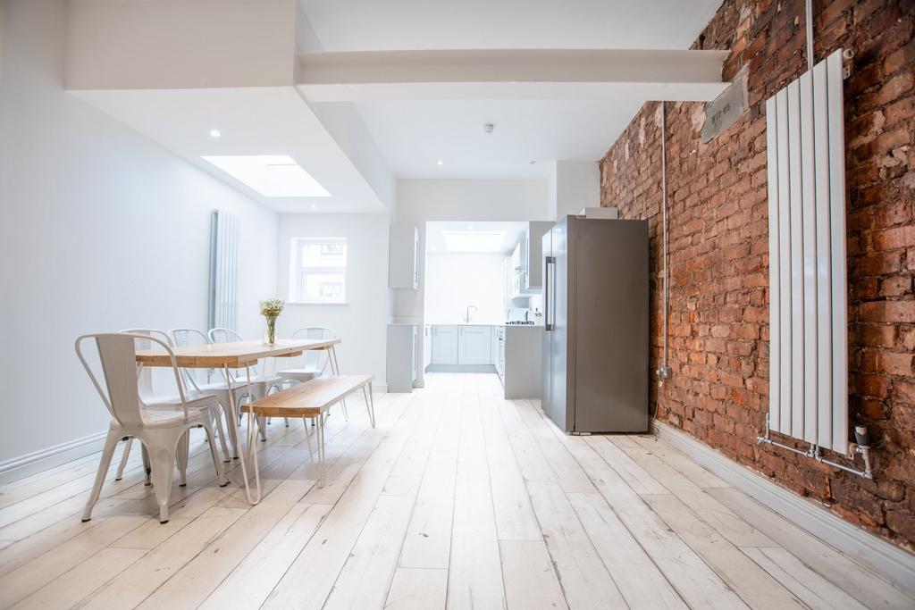 Bright, modern open-plan kitchen and dining are...