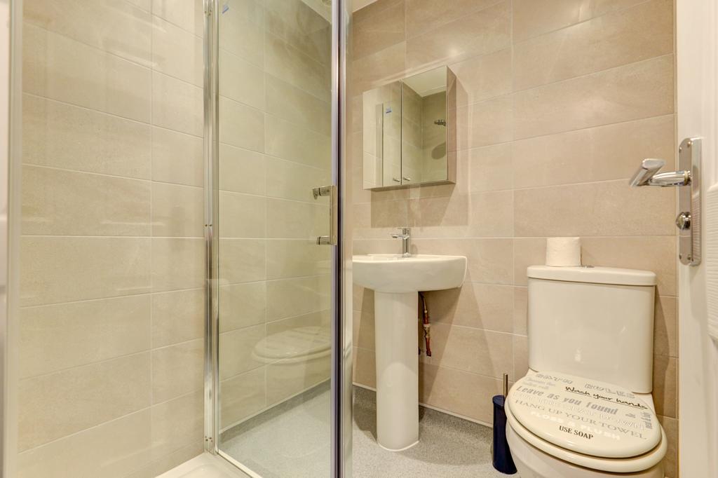 A clean and modern bathroom featuring a spaciou...