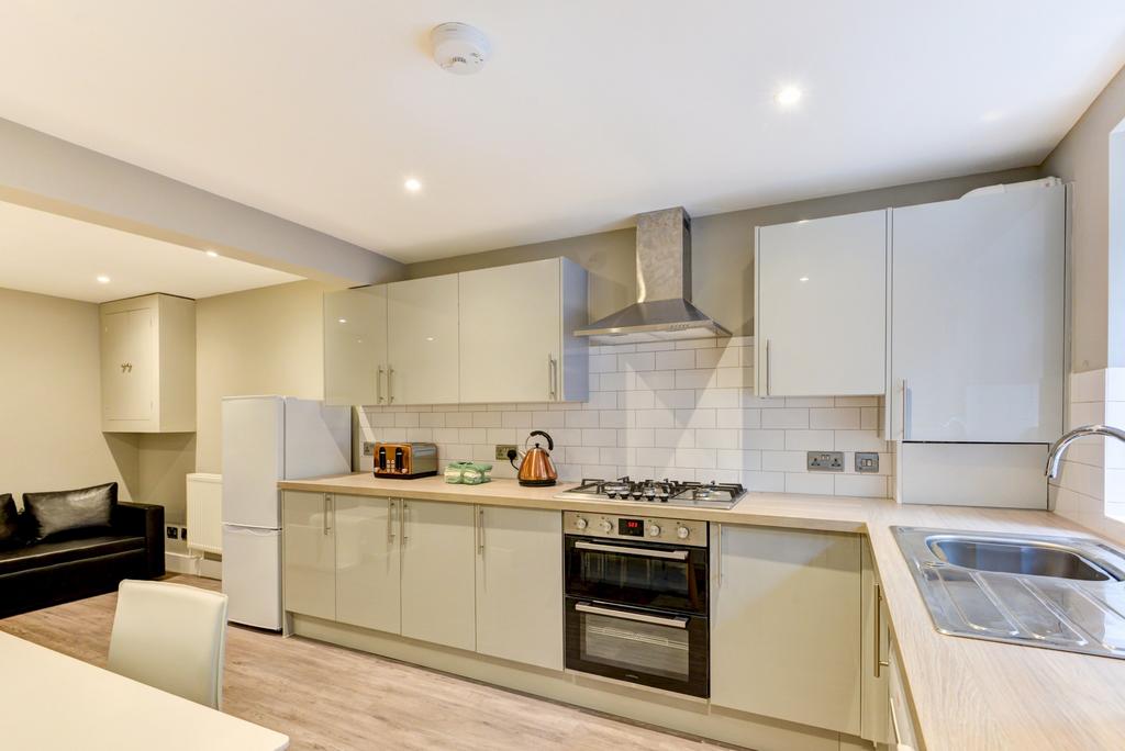 Bright and modern kitchen with ample counter sp...