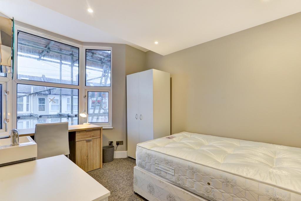 A bright and inviting double bedroom featuring ...