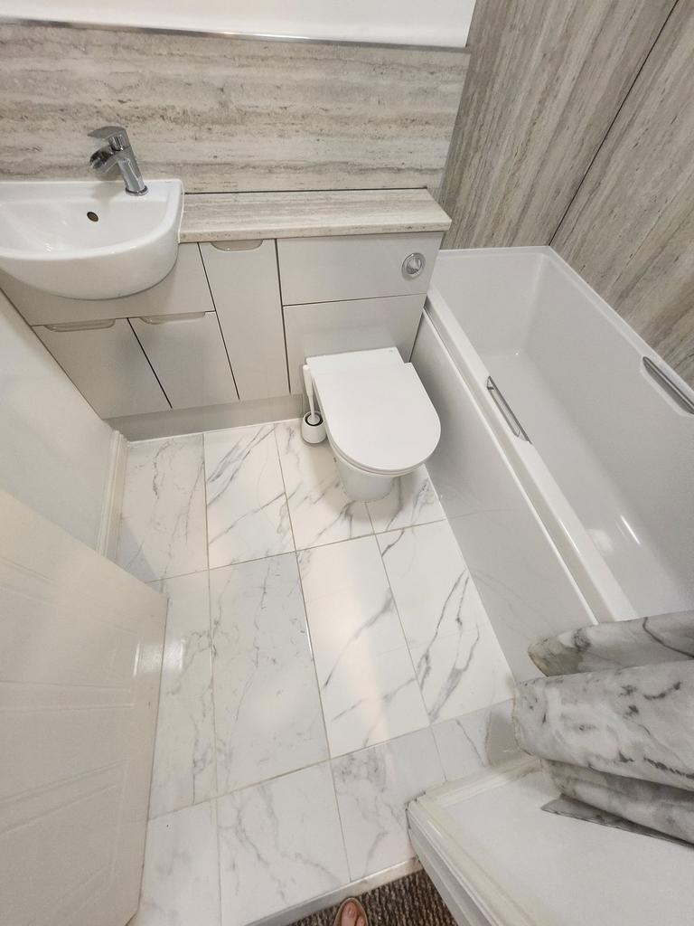 A modern, well-maintained bathroom featuring a ...