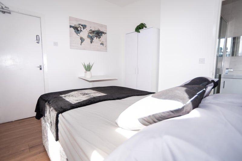 Bright, modern bedroom with a comfortable doubl...