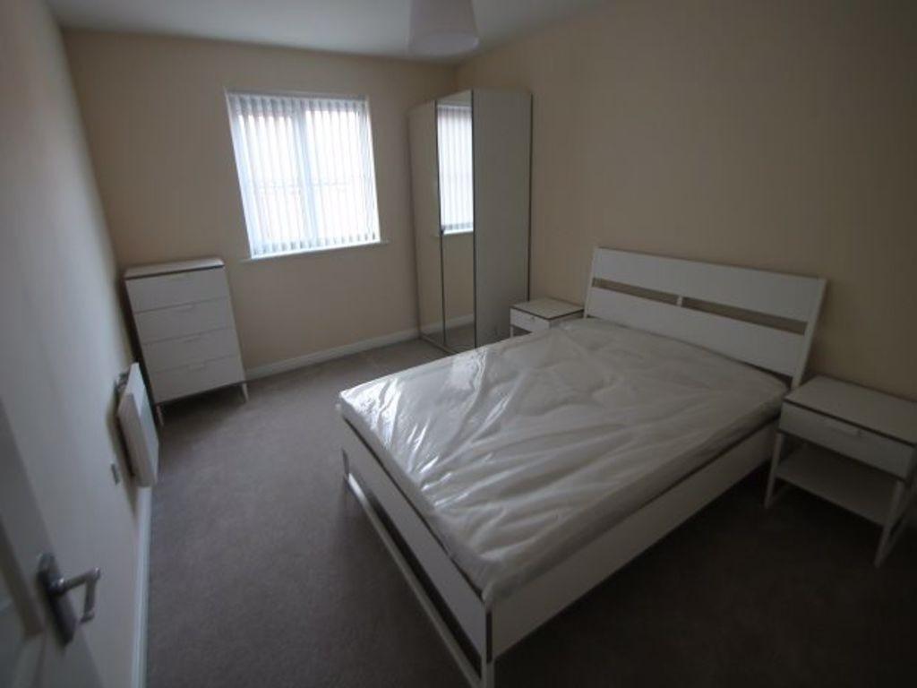 Bright, simply furnished double bedroom with a ...