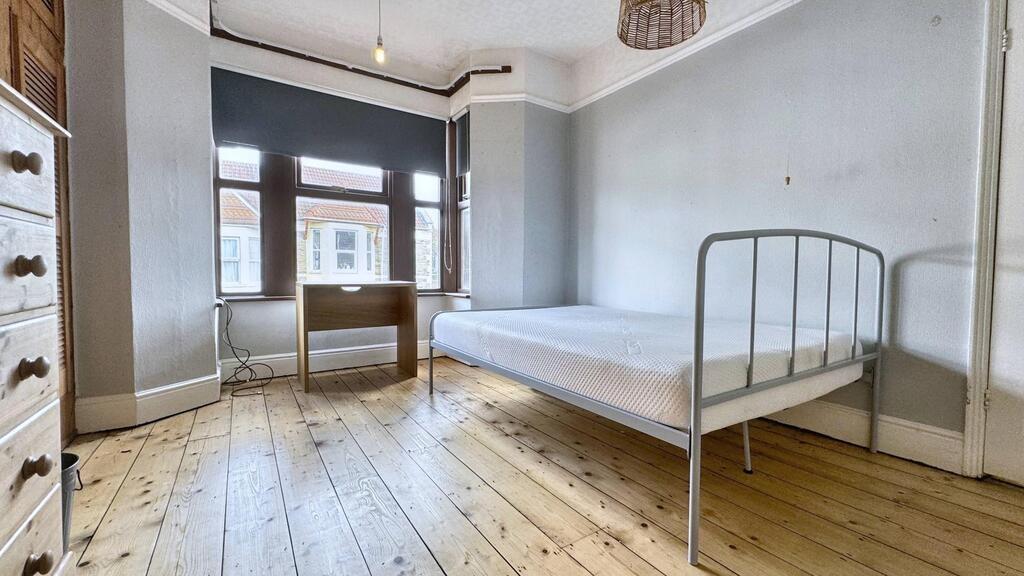 Bright, neatly presented bedroom with large bay...