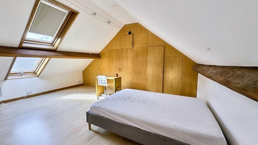 Bright attic double bedroom with sloped ceiling...