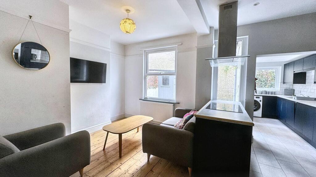 Bright, modern living area with comfortable sea...