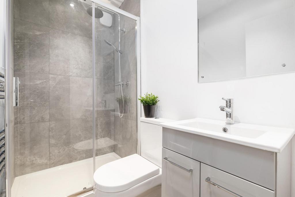 Modern bathroom with walk-in glass shower, cont...