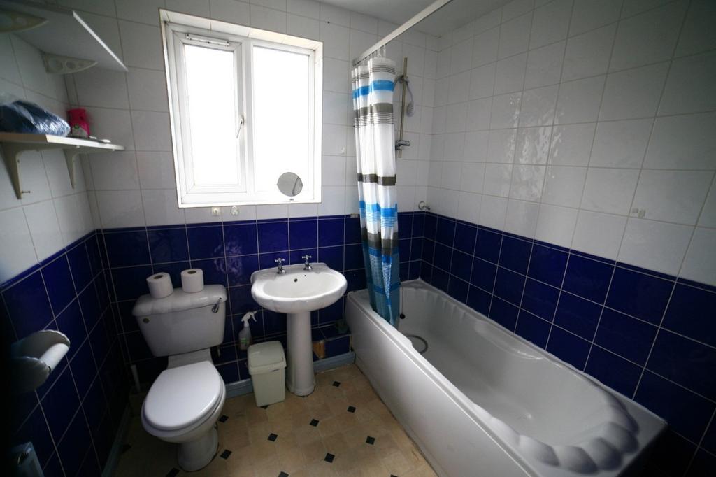 A well-appointed bathroom featuring a cozy bath...