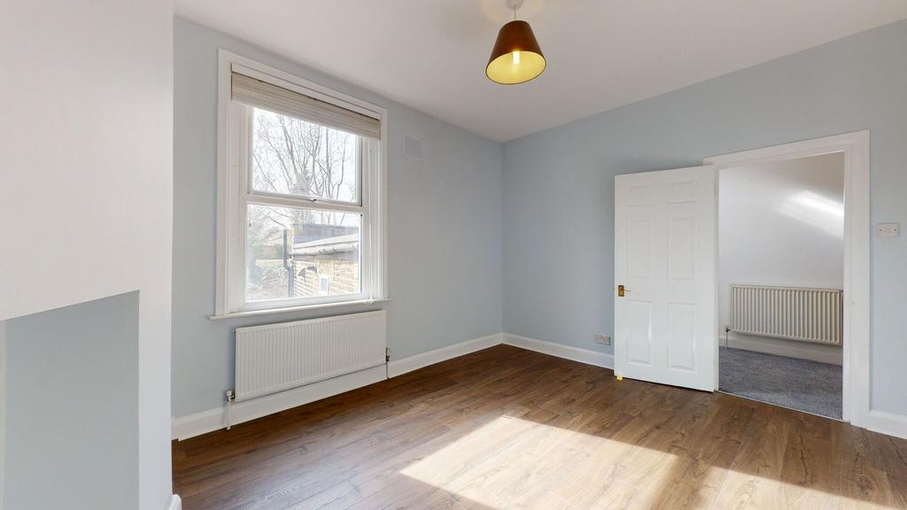 A bright and clean double bedroom featuring a l...
