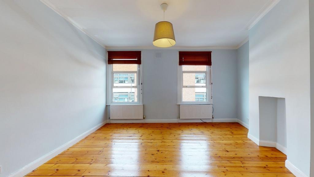 Bright and clean living room featuring polished...