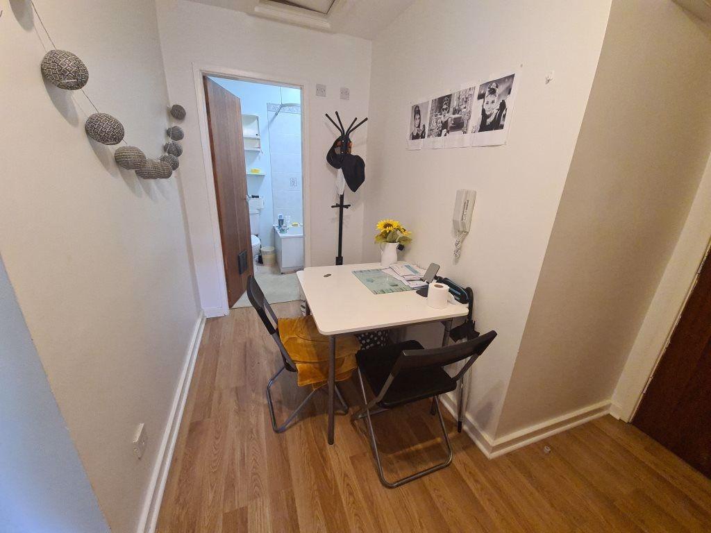 Bright, tidy shared dining or study nook with a...