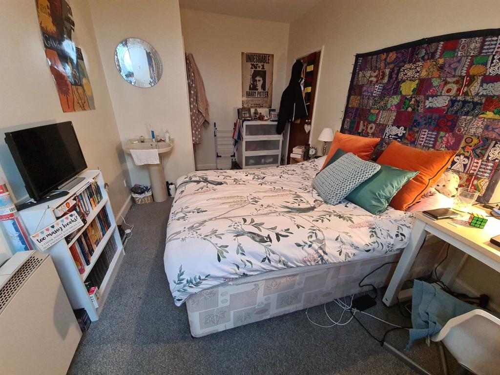 Cozy double bedroom with a comfortable bed, bed...
