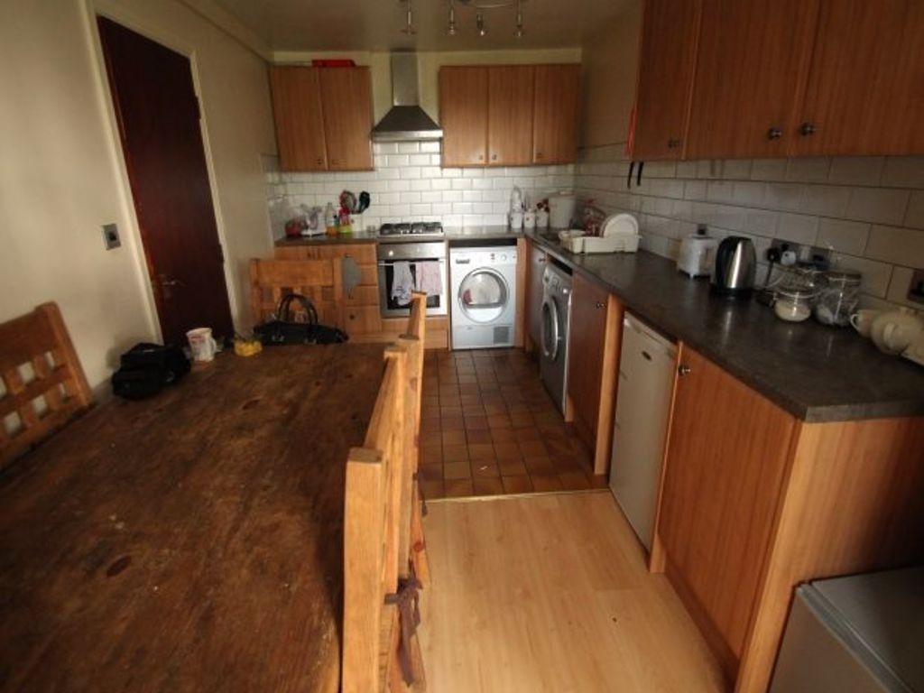 Warm, traditional kitchen with wooden cabinetry...