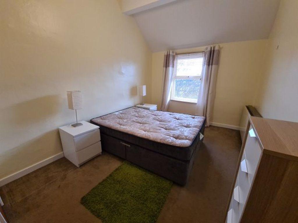 Neat double bedroom with a comfortable divan be...