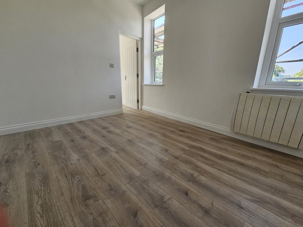 Bright, recently refurbished bedroom with large...