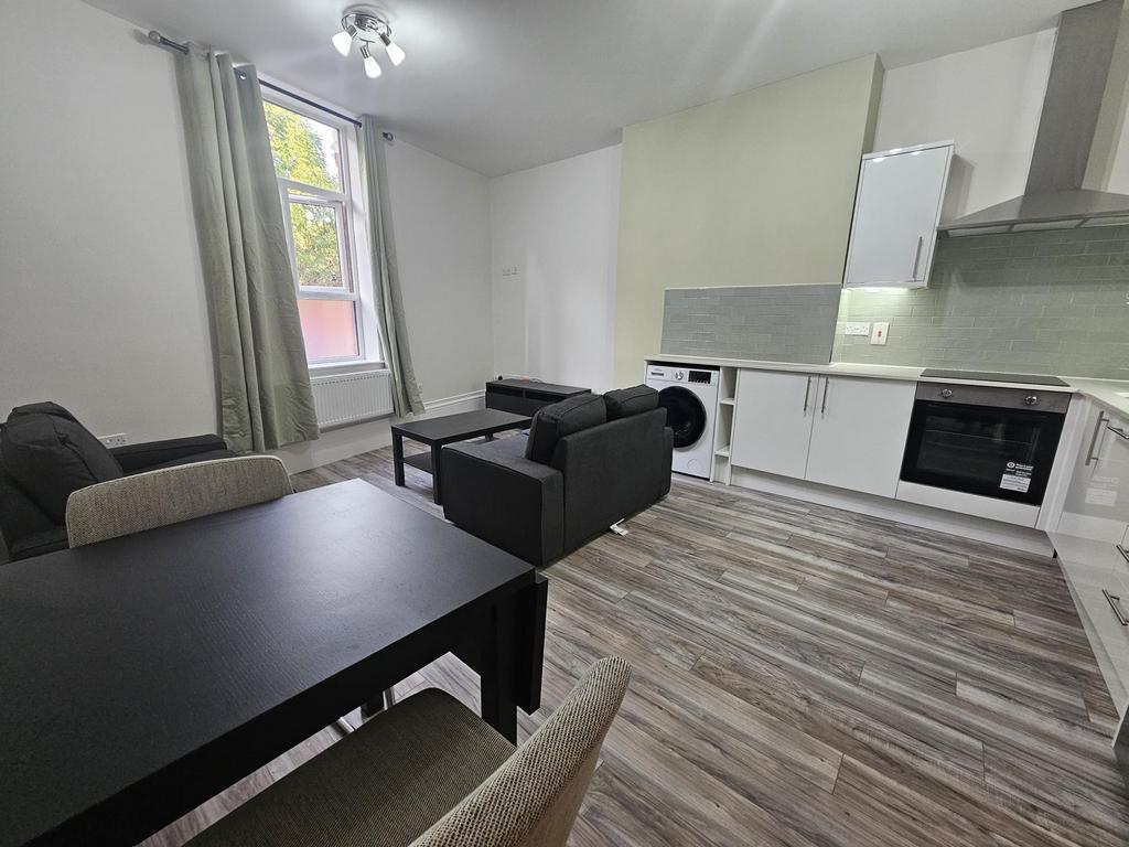 Bright open-plan living area with a modern fitt...