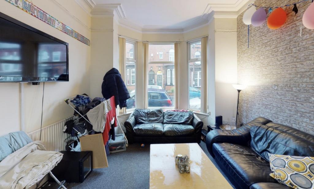 A bright and cozy living room with natural ligh...