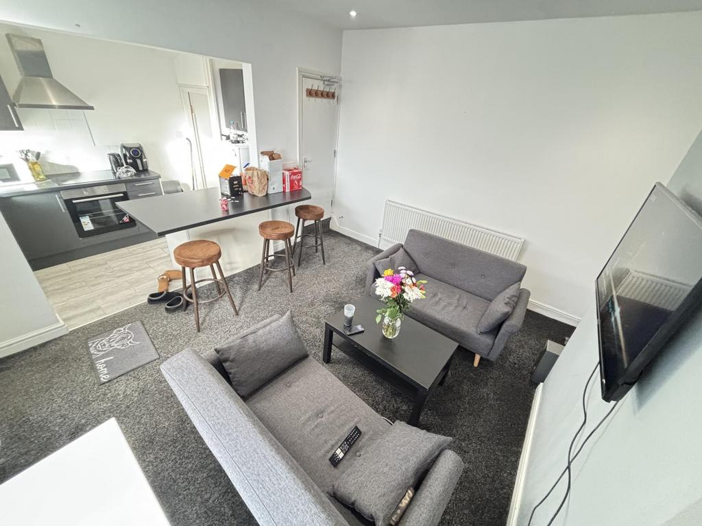 Modern and inviting living room featuring comfo...