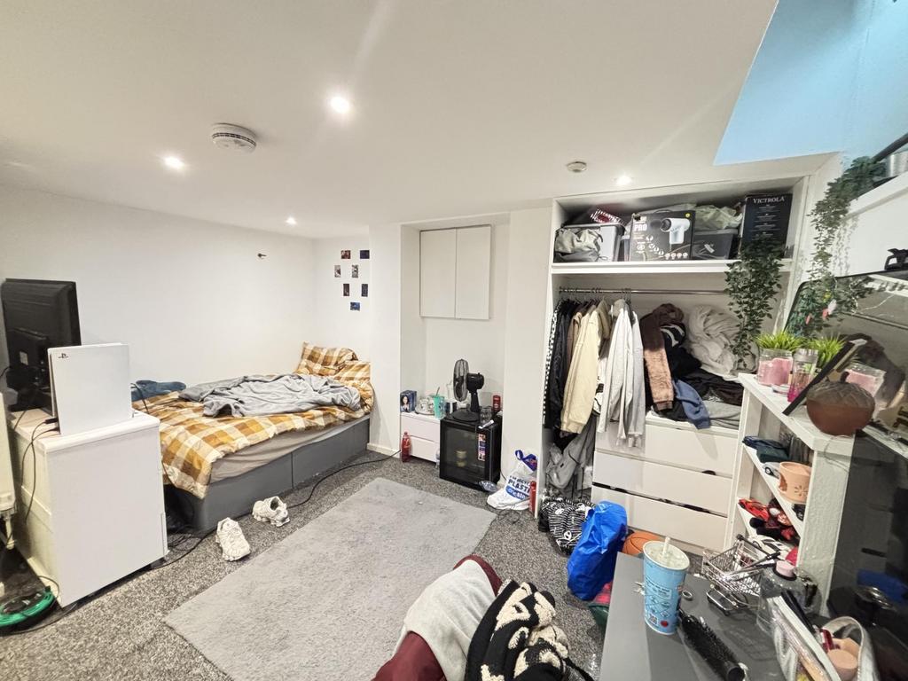 A cozy and functional living space filled with ...
