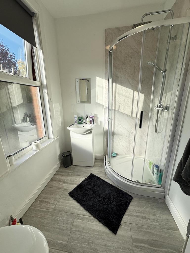 A modern, bright bathroom featuring a spacious ...
