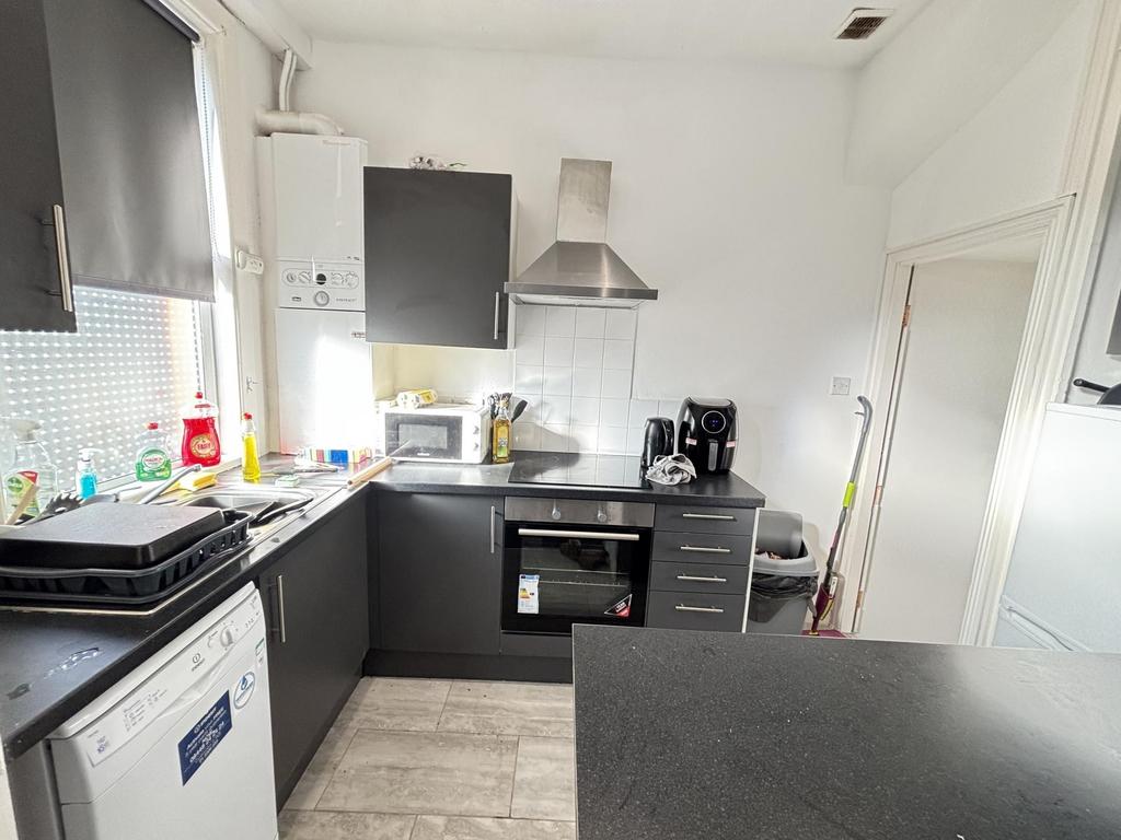 A modern kitchen featuring ample natural light,...