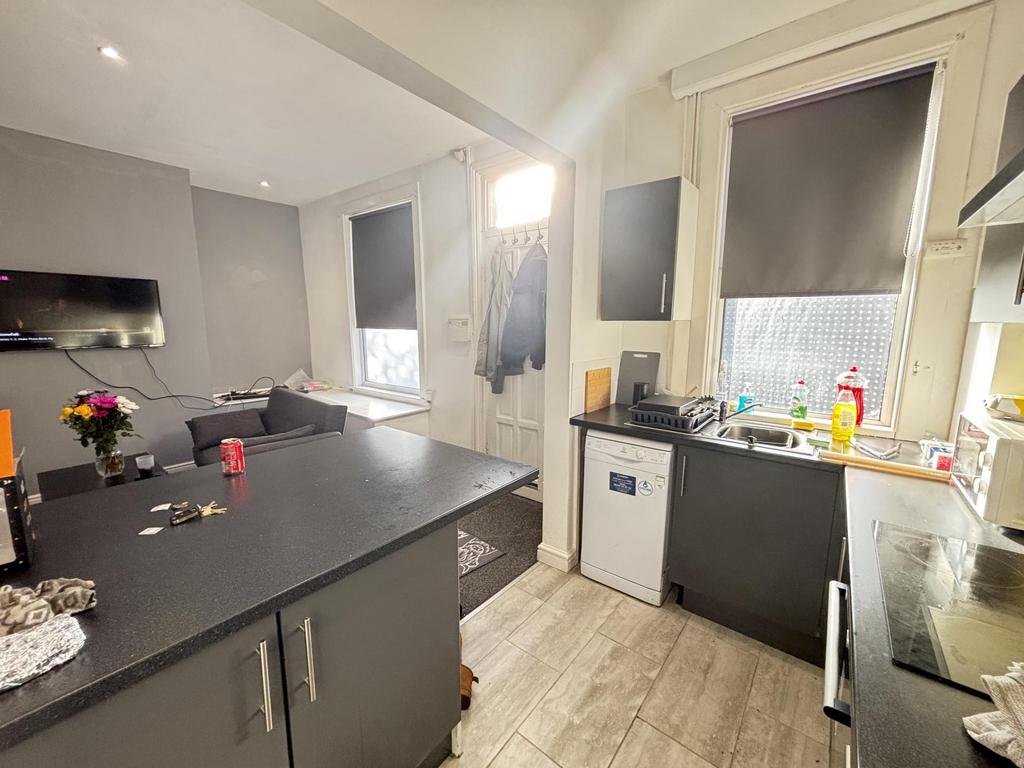 Bright and modern kitchen with ample natural li...