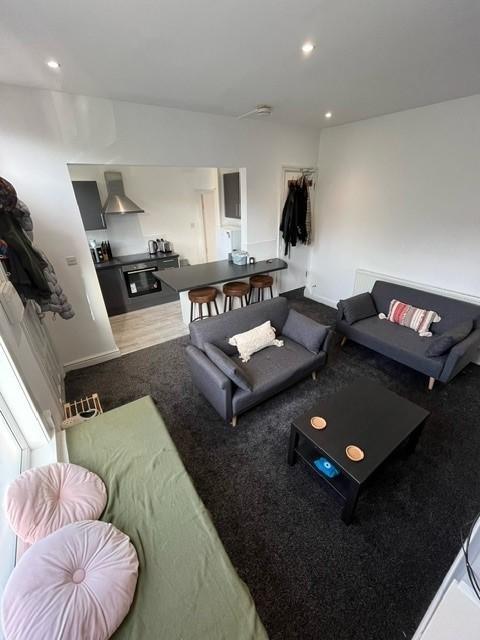 A modern and inviting living room featuring com...