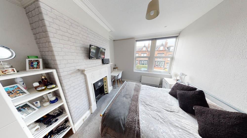 Bright and welcoming living room with large win...