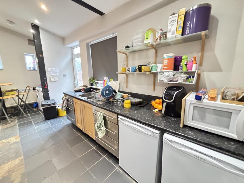 A modern and well-organized kitchen with ample ...