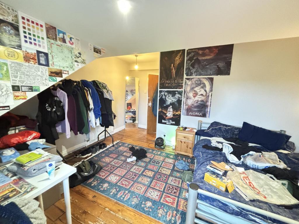A cozy living room with a large, inviting seati...