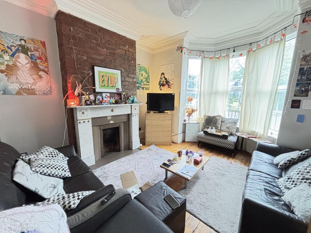 A bright and inviting living room with large wi...