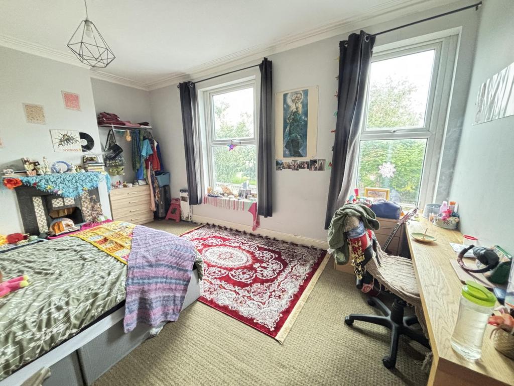 Bright and welcoming living room with large win...