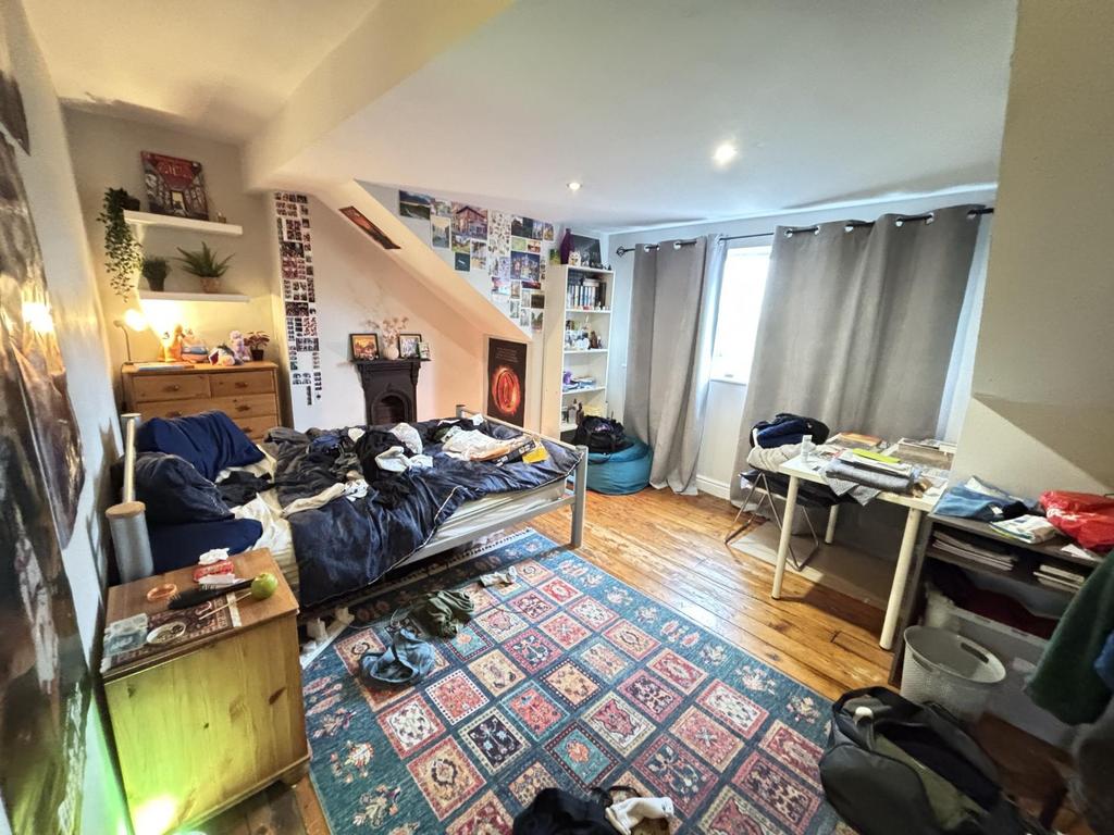 A cozy and lived-in living room featuring a com...